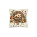 A square decorative throw pillow with a cream-colored background featuring a sleeping hedgehog illustration, a red-and-white mushroom, autumn leaves, and the text 'CURL UP & Stay Cosy'.