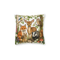 A square decorative throw pillow featuring a detailed woodland illustration with a deer, fox, owl, rabbit, badger, hedgehog, mushrooms, and the text 'Rooted in Nature' on a white background.